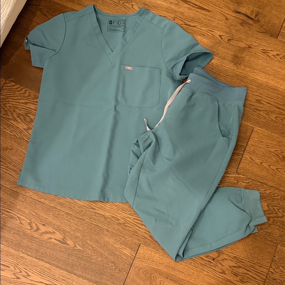 Figs scrubs— small top, petite medium bottoms.